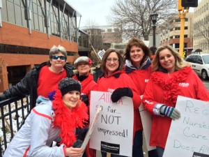 Nurses from River Falls show up to picket with other Allina nurses at United Hospital.  Bridget Nelson (kneeling), Kathy Bloom, Lori Morris, Ashley Greengard, Julie Schommer, Amy Hauenstein 